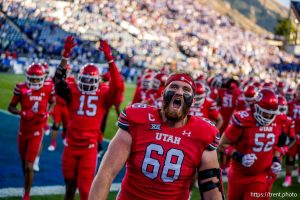 (Trent Nelson  |  The Salt Lake Tribune) Utah prepares to take the field against BYU, NCAA football at LaVell Edwards Stadium in Provo on Saturday, Oct. 18, 2025. and Utah Utes offensive lineman Jaren Kump (68) at center.