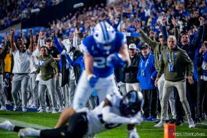 (Trent Nelson  |  The Salt Lake Tribune) The sideline erupts as BYU Cougars tight end Carsen Ryan (20) scores a touchdown as BYU hosts TCU, NCAA football in Provo on Saturday, Nov. 15, 2025.