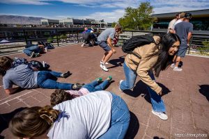 (Trent Nelson  |  The Salt Lake Tribune) People react after Charlie Kirk is shot during an appearance at Utah Valley University in Orem on Wednesday, Sept. 10, 2025.