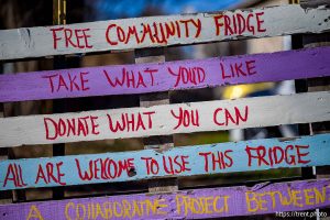 (Trent Nelson  |  The Salt Lake Tribune) The sign at a community fridge in South Salt Lake on Friday, Dec. 12, 2025.