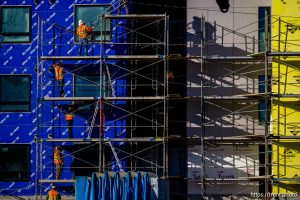 (Trent Nelson  |  The Salt Lake Tribune) Workers disassemble scaffolding during the construction of a new apartment complex in Salt Lake City on Monday, Dec. 29, 2025.