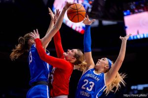 (Trent Nelson  |  The Salt Lake Tribune) BYU center Lara Rohkohl (13)  and BYU guard Marya Hudgins (23) knock the ball away from Utah guard Maty Wilke (23) as BYU hosts Utah, NCAA basketball in Provo on Saturday, Jan. 31, 2026.