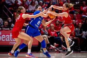 (Trent Nelson  |  The Salt Lake Tribune) BYU Cougars guard Arielle MacKey-Williams (8) defended by Utah Utes forward Reese Ross (20) and Utah Utes guard Maty Wilke (23) as Utah hosts BYU, NCAA basketball in Salt Lake City on Saturday, Feb. 21, 2026.