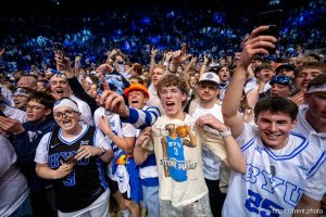 (Trent Nelson  |  The Salt Lake Tribune) BYU fans on the court after the win as BYU hosts Texas Tech, NCAA basketball in Provo on Saturday, March 7, 2026.