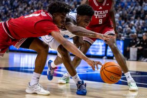 (Trent Nelson  |  The Salt Lake Tribune) BYU Cougars forward Kennard Davis Jr. (30) and Texas Tech Red Raiders guard Christian Anderson (4) reach for a loose ball as BYU hosts Texas Tech, NCAA basketball in Provo on Saturday, March 7, 2026.