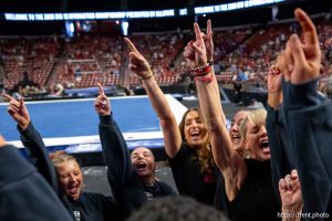 (Trent Nelson  |  The Salt Lake Tribune) Carly Dockendorf and team celebrate the first place win at the Big 12 Gymnastics Championship at the Maverik Center in West Valley City on Saturday, March 21, 2026.